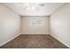 Spacious bedroom with carpet, ceiling fan, and a window at 2039 Oak Park Ln, Decatur, GA 30032