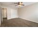 Bedroom boasts carpet, ceiling fan and double door closet at 2039 Oak Park Ln, Decatur, GA 30032