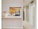 Open kitchen view with stainless refrigerator, wooden cabinets, and breakfast bar at 2039 Oak Park Ln, Decatur, GA 30032
