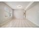 Large living area showcases tile flooring, neutral walls, and bright natural light at 2039 Oak Park Ln, Decatur, GA 30032