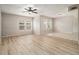 Large living room with hardwood floors, big windows, and multiple living spaces at 2039 Oak Park Ln, Decatur, GA 30032
