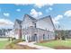 Beautiful two-story townhome with gray brick and manicured landscaping at 5753 Tillman Way, Powder Springs, GA 30127