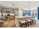 Modern kitchen with stainless steel appliances, granite countertops, and an island with seating at 6775 Marlow Dr, Cumming, GA 30041
