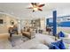Open-concept living area with a sofa and a view of the kitchen and dining area at 6775 Marlow Dr, Cumming, GA 30041
