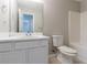 Clean bathroom featuring white vanity, toilet, and tub, ideal for relaxation and functionality at 725 Signature Trce, Palmetto, GA 30268