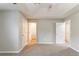 Empty bedroom with neutral paint, carpet and view to en-suite bathroom at 725 Signature Trce, Palmetto, GA 30268