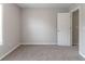 Bright bedroom featuring neutral walls, plush carpeting, and a window that offers natural light at 725 Signature Trce, Palmetto, GA 30268