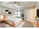 Bright main bedroom features a tray ceiling, a window, and neutral paint at 725 Signature Trce, Palmetto, GA 30268