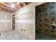 An unfinished basement area offering ample storage and utility connections, awaiting your personal touch at 725 Signature Trce, Palmetto, GA 30268