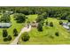 Aerial view of a charming property with lush greenery, and a beautiful home at 107 Bowen Rd, Stockbridge, GA 30281