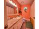 Bright bathroom with a granite countertop vanity, shower/tub combo, and classic fixtures at 107 Bowen Rd, Stockbridge, GA 30281