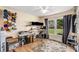 Well-lit bedroom with hardwood floors, a sunny window, and workout and crafting equipment at 107 Bowen Rd, Stockbridge, GA 30281