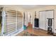 Bright bedroom featuring wood floors, built-in closet, and exercise equipment at 107 Bowen Rd, Stockbridge, GA 30281