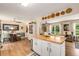 Cozy dining area adjacent to the kitchen featuring hardwood floors and lots of natural light at 107 Bowen Rd, Stockbridge, GA 30281