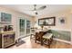 Dining area with backyard access, a modern ceiling fan, and space for a wine fridge at 107 Bowen Rd, Stockbridge, GA 30281