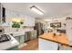 Bright and airy kitchen featuring an island with a butcher block top and stainless steel appliances at 107 Bowen Rd, Stockbridge, GA 30281