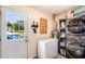 Functional laundry room with lots of storage space and outdoor access at 107 Bowen Rd, Stockbridge, GA 30281