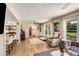 Cozy living room featuring wood-look flooring, lots of natural light, and an open layout at 107 Bowen Rd, Stockbridge, GA 30281