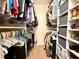 This walk-in closet features shelving and hanging storage for an organized wardrobe at 107 Bowen Rd, Stockbridge, GA 30281