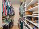 Organized walk-in closet with shelves and hanging space for clothes and shoes at 107 Bowen Rd, Stockbridge, GA 30281