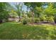Large, well-maintained backyard with lush lawn and mature trees offering privacy and space at 1135 Timberland Se Dr, Marietta, GA 30067
