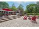 Outdoor living at its finest with a fire pit, hot tub, and comfortable patio seating amidst lush landscaping at 1135 Timberland Se Dr, Marietta, GA 30067