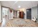 Hallway in basement with doors, stylish area rug, lighting, and decorative chest with lamps at 1135 Timberland Se Dr, Marietta, GA 30067