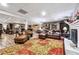 Spacious basement with fireplace, leather furniture, wet bar, decorated with animal mounts and art at 1135 Timberland Se Dr, Marietta, GA 30067
