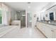 Luxurious bathroom features a soaking tub, glass-enclosed shower, and double vanity with white marble at 1135 Timberland Se Dr, Marietta, GA 30067