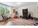 Bright exercise room with essential equipment including a treadmill, rocking chair, and lots of natural light at 1135 Timberland Se Dr, Marietta, GA 30067