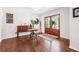 Elegant foyer features rich hardwood floors, a wooden console table, and double glass doors at 1135 Timberland Se Dr, Marietta, GA 30067