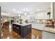 Spacious kitchen featuring a large island, white cabinets, and stainless steel appliances, with an open layout at 1135 Timberland Se Dr, Marietta, GA 30067
