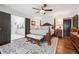 Spacious bedroom with hardwood floors, a four-poster bed, and ensuite bathroom access at 1135 Timberland Se Dr, Marietta, GA 30067