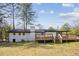 Large backyard with wooden deck at 3698 Sharon Dr, Powder Springs, GA 30127