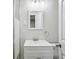 Modern bathroom features vanity sink, stylish lighting, and a glimpse of a shower at 3698 Sharon Dr, Powder Springs, GA 30127