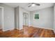 Spacious bedroom features hardwood floors, ceiling fan, window, and closet at 3698 Sharon Dr, Powder Springs, GA 30127