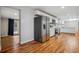 Bright kitchen features stainless steel appliances and hardwood floors extending into the adjacent living area at 3698 Sharon Dr, Powder Springs, GA 30127