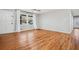 Inviting living room with hardwood floors, light walls, and natural light from the windows at 3698 Sharon Dr, Powder Springs, GA 30127