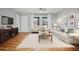 Charming living room with modern furnishings, hardwood floors, and plenty of natural light at 3698 Sharon Dr, Powder Springs, GA 30127
