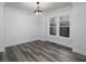 Well-lit dining room with hardwood floors and large windows providing abundant natural light at 742 Olde Towne Ln, Marietta, GA 30068