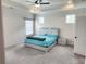 Bedroom features a decorative ceiling fan, natural light from accent windows, and plush carpet flooring at 1177 Chastain Dr, Sugar Hill, GA 30518