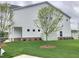 A side view shows a charming two-story home with a well-manicured lawn at 1177 Chastain Dr, Sugar Hill, GA 30518