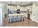 Modern kitchen with white cabinets, stainless steel appliances, and a large island at 1177 Chastain Dr, Sugar Hill, GA 30518