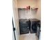 The laundry room boasts a modern washer and dryer on tile flooring at 1177 Chastain Dr, Sugar Hill, GA 30518