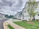 Street view of charming two-story homes, each with a two-car garage at 1177 Chastain Dr, Sugar Hill, GA 30518