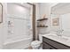 Well-lit bathroom boasts a clean design, featuring a shower-tub combo and modern vanity at 2078 Brookhill Way, Snellville, GA 30078