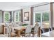 Open dining area with table, chairs, sliding glass door, and abundant natural light at 2078 Brookhill Way, Snellville, GA 30078