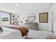 Bright main bedroom showcasing a large window, carpeted flooring, and stylish decor at 2078 Brookhill Way, Snellville, GA 30078