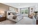 Comfortable carpeted main bedroom features large windows and neutral tones at 2078 Brookhill Way, Snellville, GA 30078