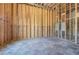 Unfinished basement featuring open framing and smooth concrete flooring, offering potential for expansion at 30 Grand Georgian Ne Ct, Cartersville, GA 30121